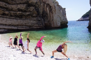 Group Beach Yoga, Reversed Warrior